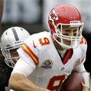 FILE - In this Dec. 16, 2012, file photo, Kansas City Chiefs quarterback Brady Quinn (9) is sacked by Oakland Raiders linebacker Philip Wheeler during the second quarter of an NFL football game in Oakland, Calif. Quinn is the new backup quarterback for the Seattle Seahawks after agreeing to terms with the club. The deal was announced by the team on Tuesday, April 9, 2013. (AP Photo/Marcio Jose Sanchez, File)